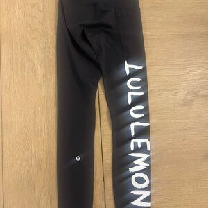 lululemon size 2 Black Leggings with White Logo/ed Curtis